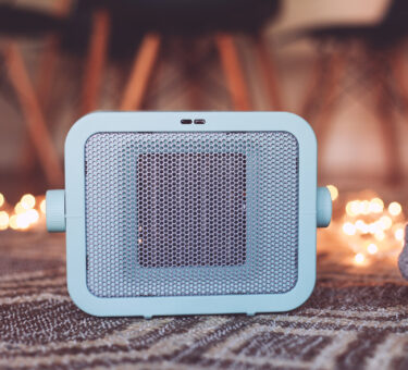 a blue heater on the carpet in a cosy room feet i 2026 01 11 09 30 07 utc scaled