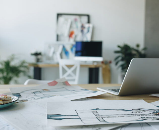 close up view of open laptop and sketches on table 2026 03 12 23 58 28 utc scaled