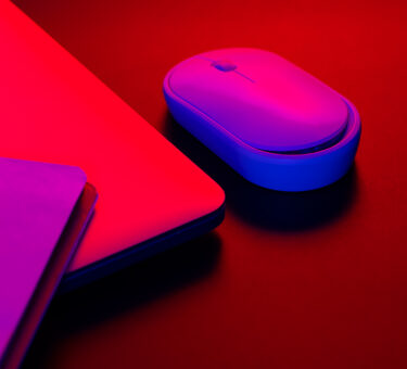 computer mouse near a laptop in neon lighting clo 2026 01 09 08 22 30 utc scaled