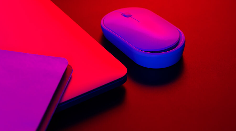 computer mouse near a laptop in neon lighting clo 2026 01 09 08 22 30 utc scaled