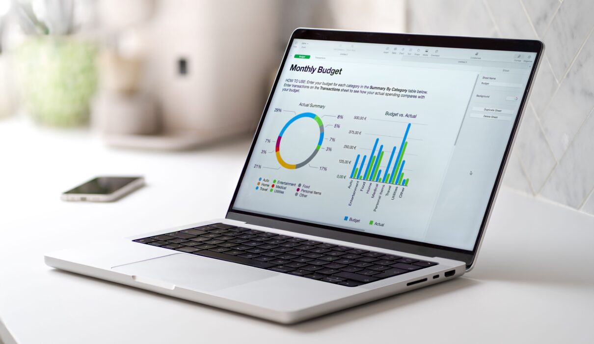 gray laptop with a monthly budged report with grap 2026 01 07 07 17 18 utc 1 scaled