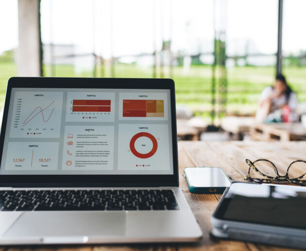 laptop with diagrams and gadgets on table in cafe 2026 01 09 07 32 37 utc scaled