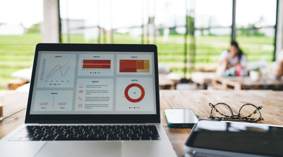 laptop with diagrams and gadgets on table in cafe 2026 01 09 07 32 37 utc scaled