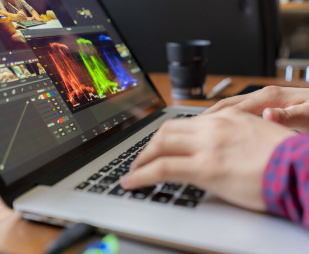 male producer edit video on his laptop in studio b 2026 01 07 05 59 47 utc scaled