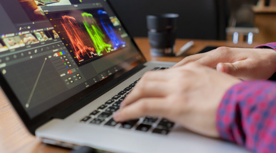 male producer edit video on his laptop in studio b 2026 01 07 05 59 47 utc scaled