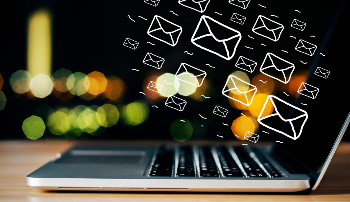 side view of laptop on desktop with digital emails 2026 01 11 08 35 52 utc scaled